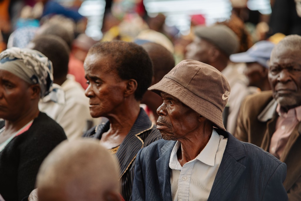 Elderly residents gathered under the marquee for the Christmas hamper distribution