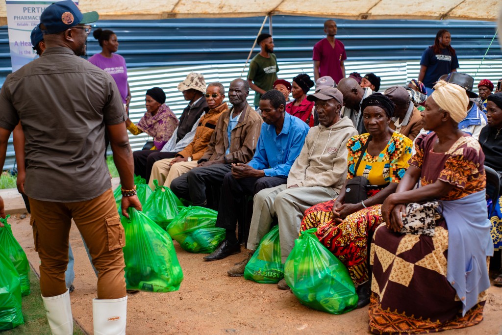 Volunteers distributing Christmas hampers to elderly residents